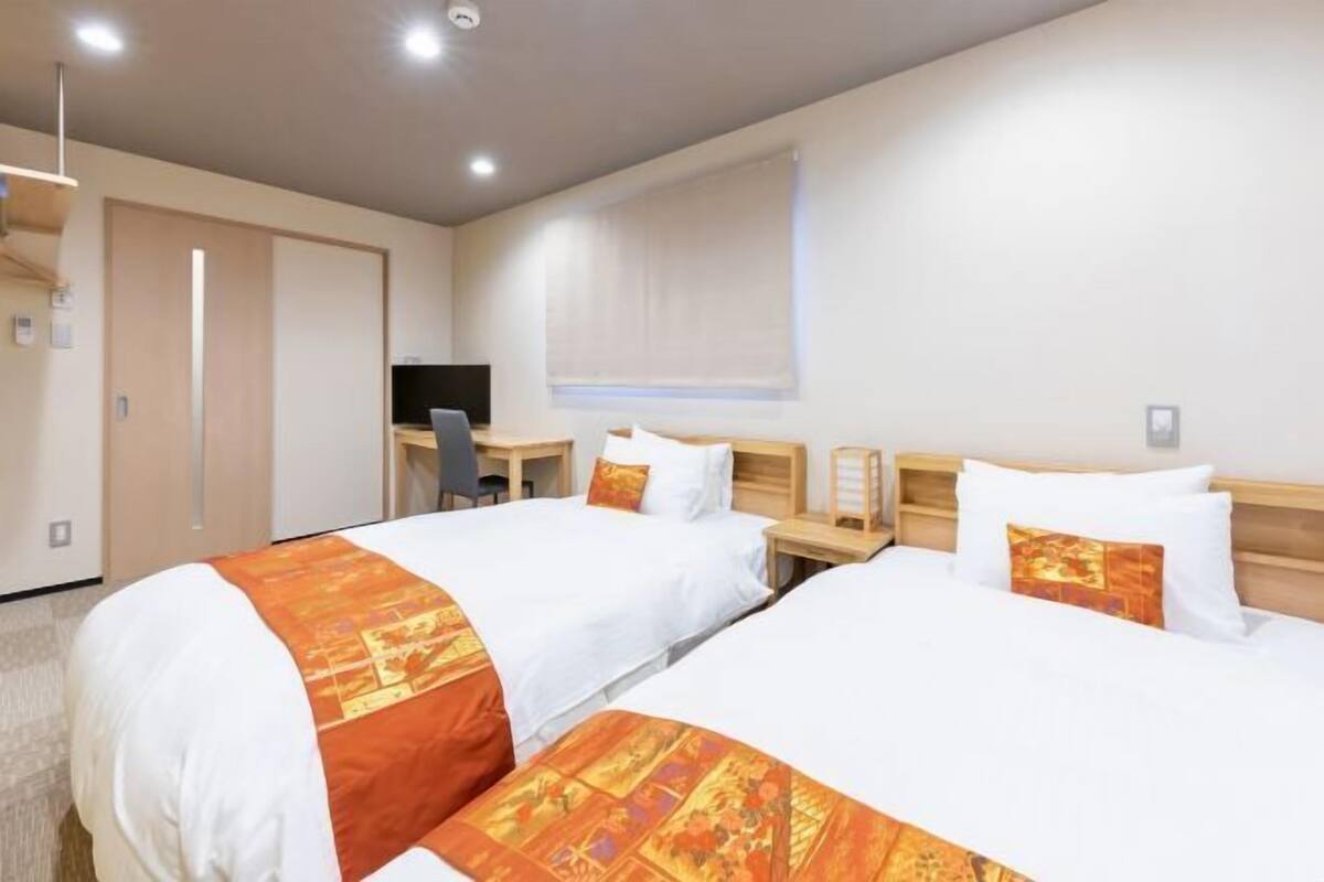 Desk, laptop workspace, free WiFi, bed sheets