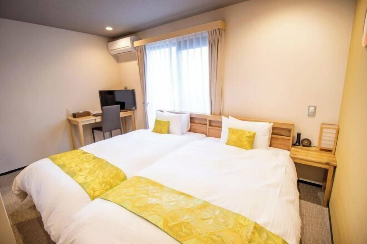 Desk, laptop workspace, free WiFi, bed sheets