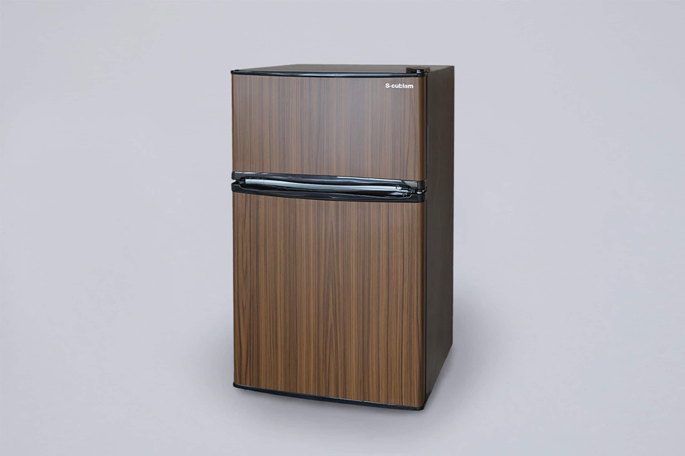 A tall, wooden-framed refrigerator with a glossy finish and a brand name on the top.