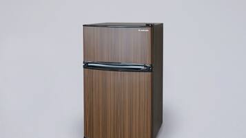 A tall, wooden-framed refrigerator with a glossy finish and a brand name on the top.