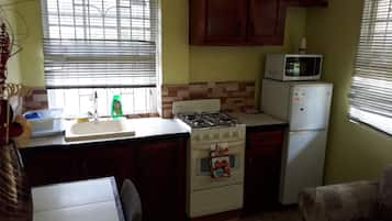 Fridge, microwave, electric kettle, cookware/dishes/utensils