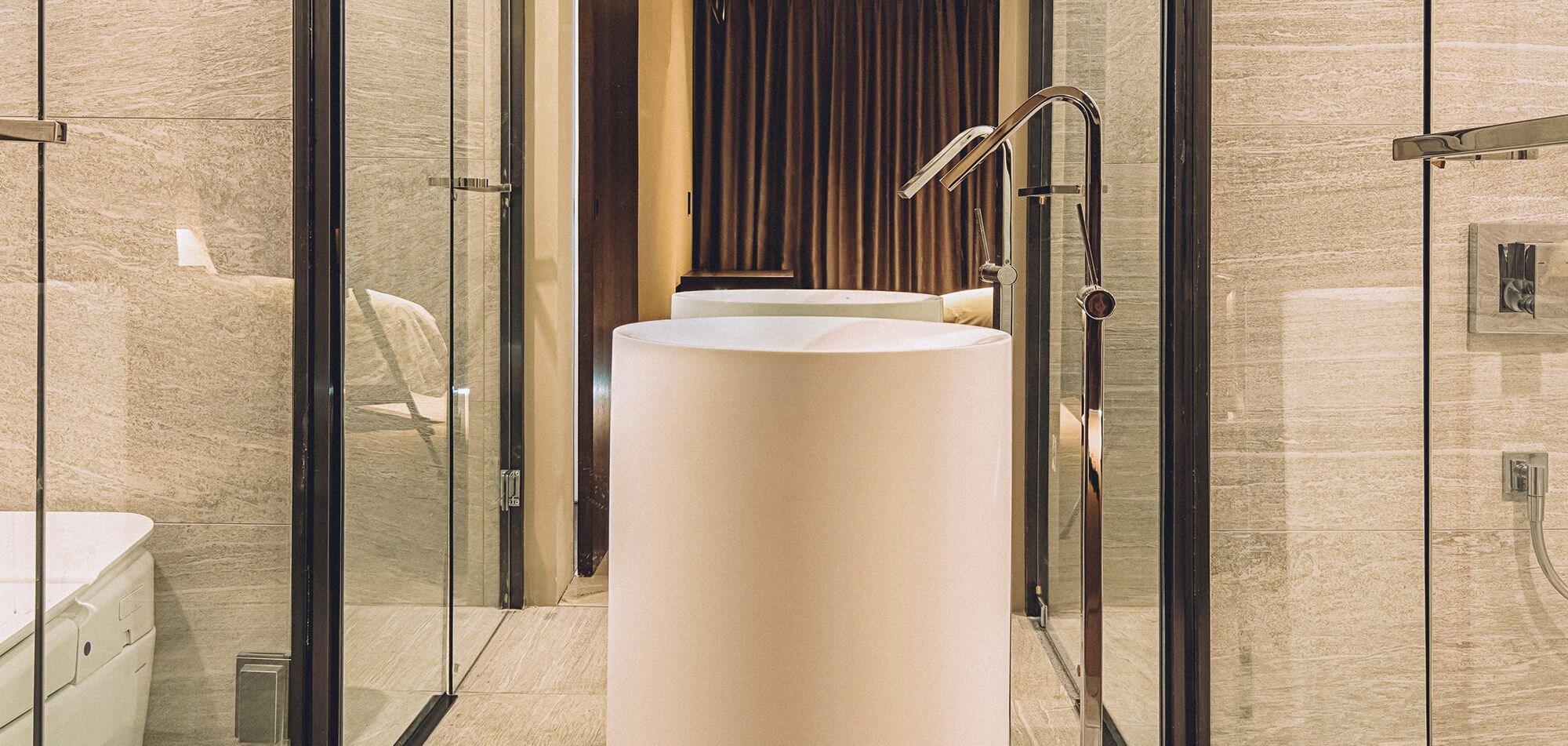 trunk royal suite | bathroom | designer toiletries, hair dryer, bathrobes, slippers