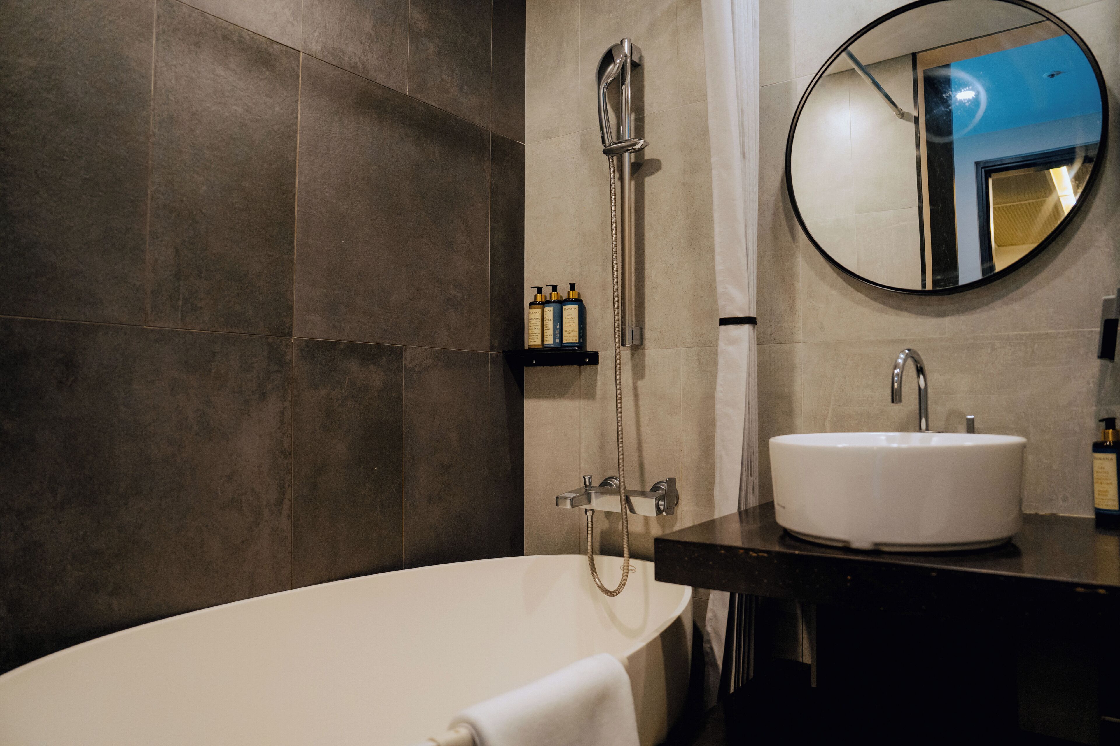 designer toiletries, hair dryer, bathrobes, slippers