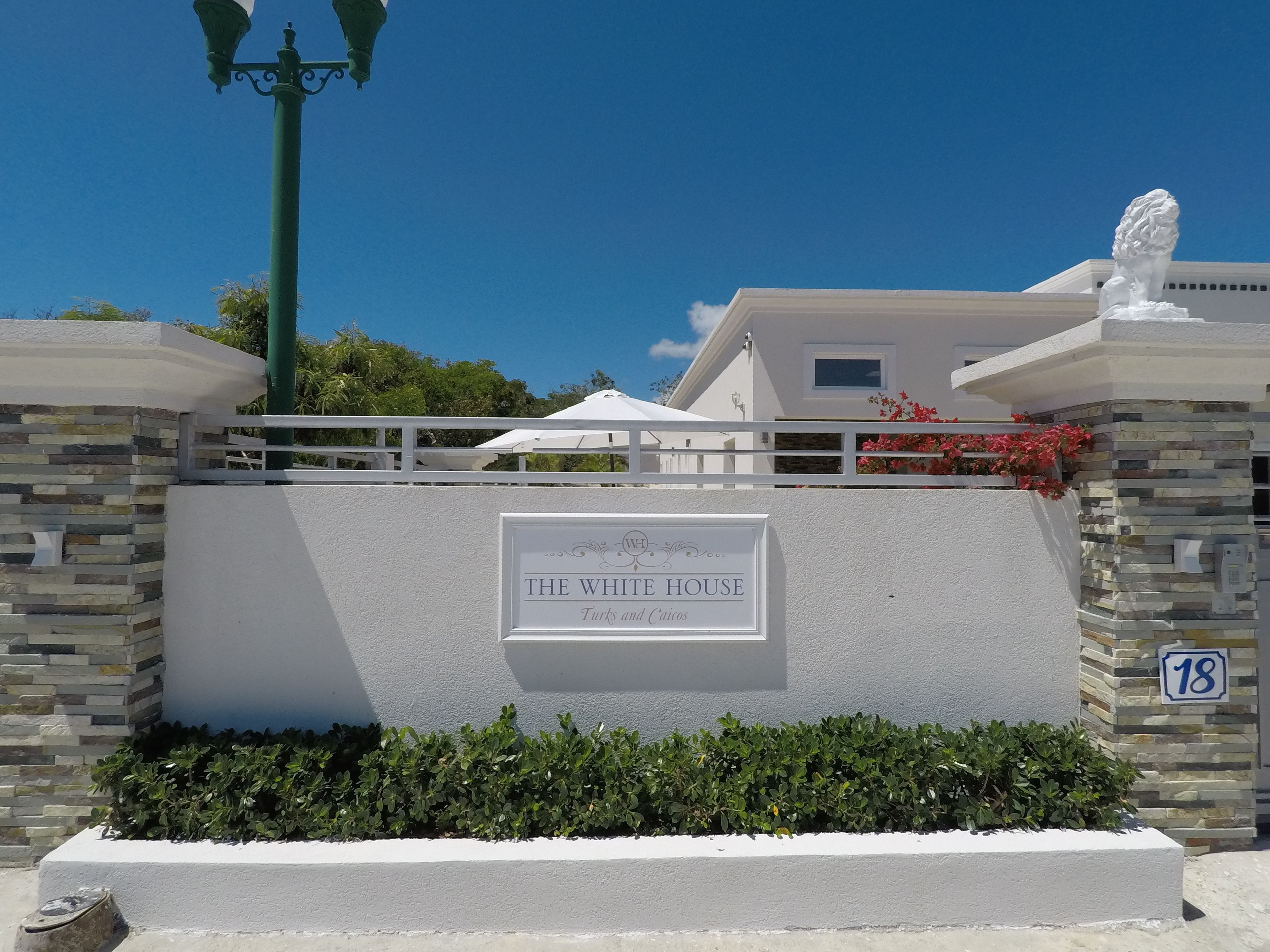 A building with a sign reading "The White House Turks and Caicos".