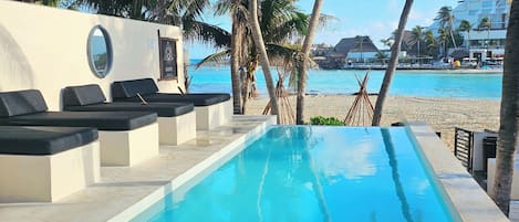 Outdoor pool, pool umbrellas, sun loungers