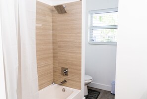 Hair dryer, towels, shampoo, toilet paper