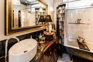 Combined shower/tub, hair dryer, towels, soap