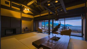 Japanese Western Style Room with Private Open-air Bath, Ocean View | Living room | Flat-screen TV