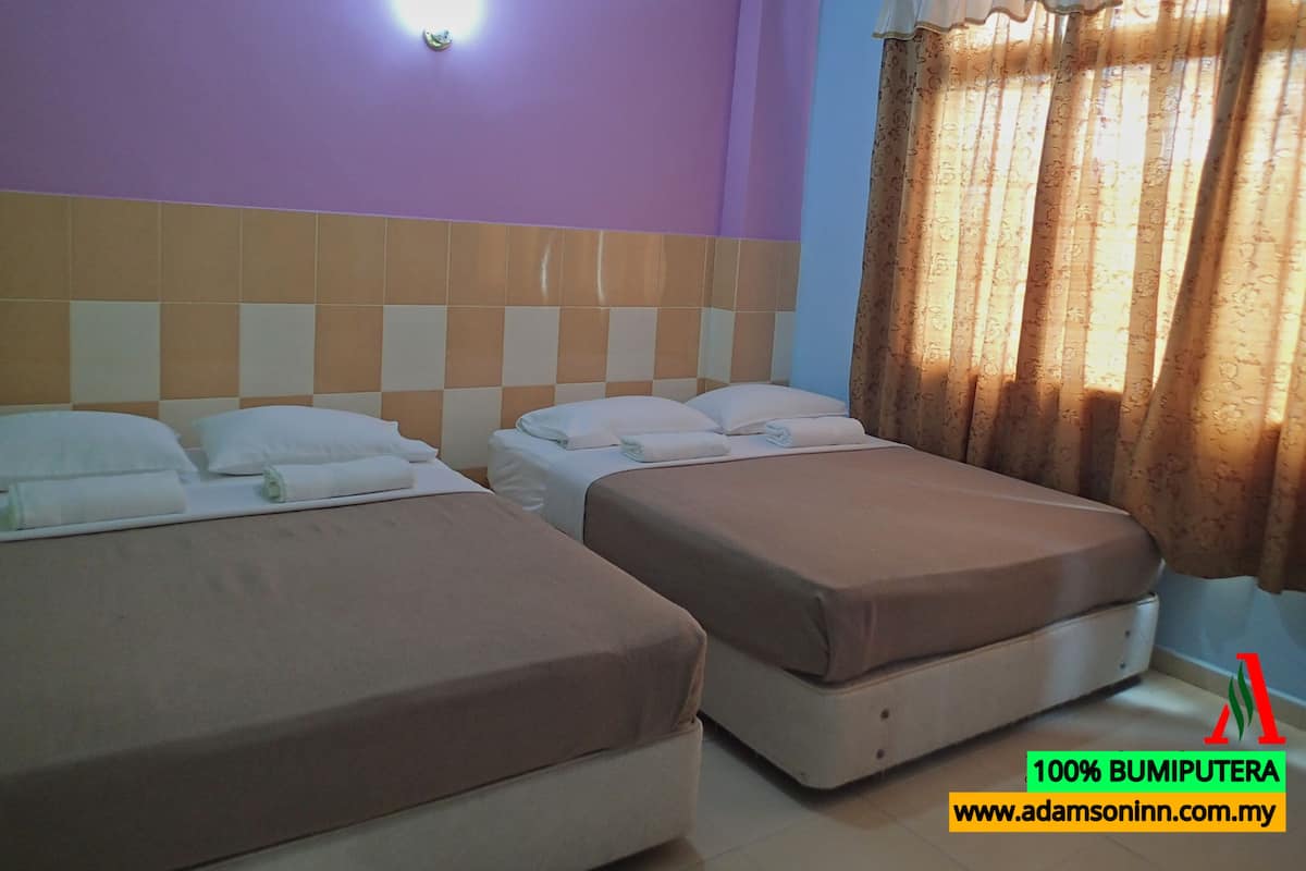 Deluxe Quadruple Room, 2 Queen Beds, City View | Living area | Flat-screen TV