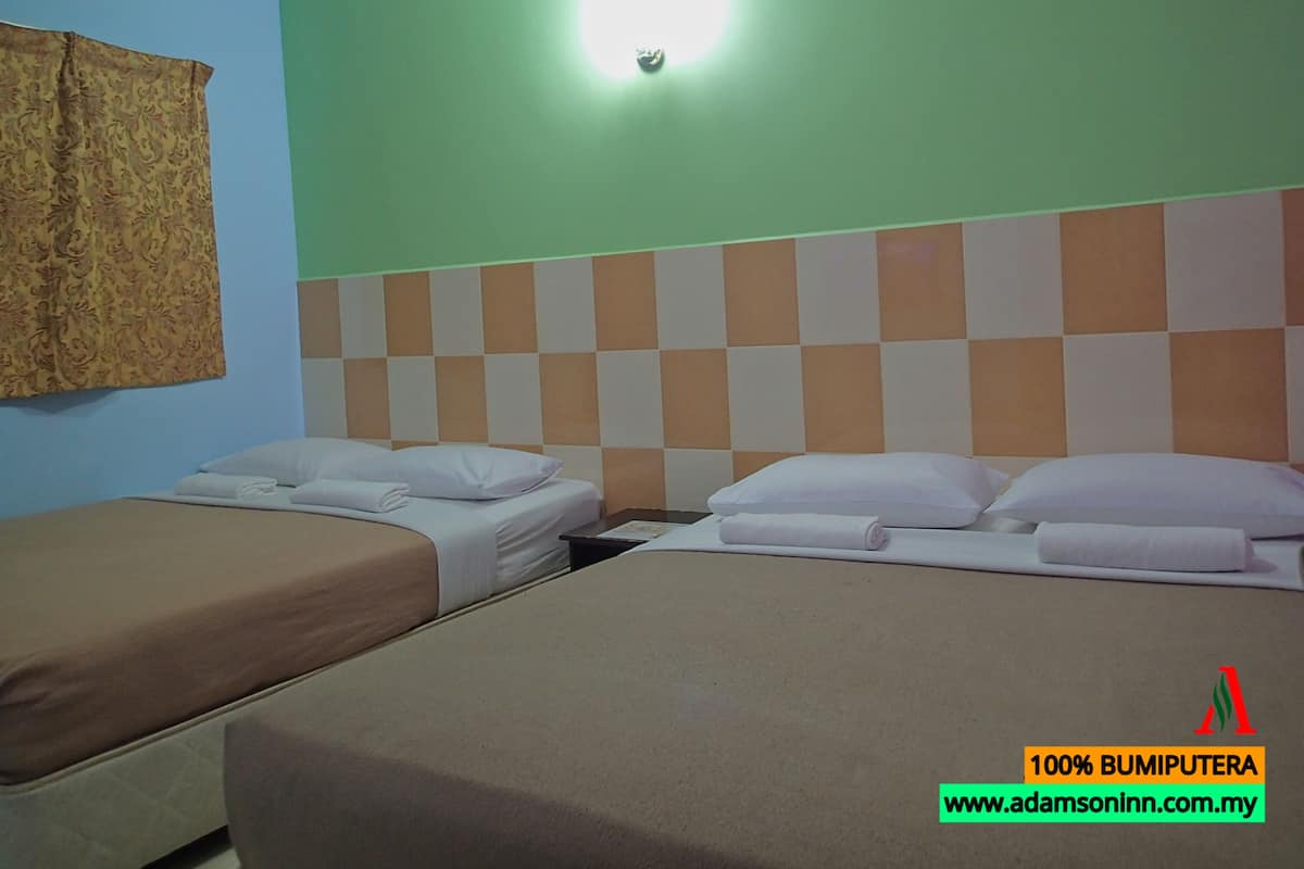Superior Quadruple Room, 2 Queen Beds, No Windows | Living area | Flat-screen TV
