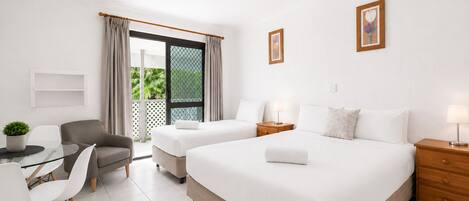 Executive Twin Room | Desk, laptop workspace, blackout drapes, iron/ironing board