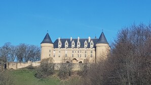 A large castle with multiple towers and a prominent central building.