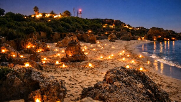 A beach with rocks and candles. - T2-2º vista mar, piscina, bbq, para a praia vai a (Albufeira)