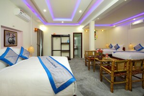 Family Quadruple Room, Garden View | Premium bedding, minibar, desk, soundproofing