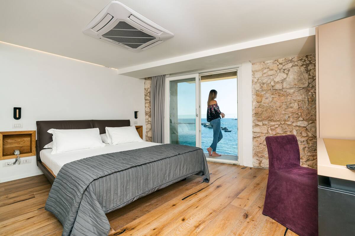 Deluxe Suite, Sea View | 1 bedroom, down comforters, minibar, in-room safe
