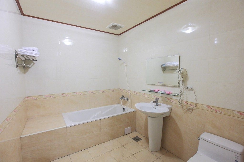 Quadruple Room, 2 Double Beds | Bathroom | Shower, free toiletries, hair dryer, slippers