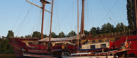 A marina with several sailboats docked.