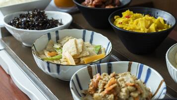 A variety of dishes in bowls on a table.