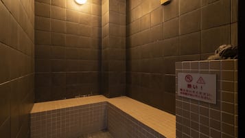 Shower area with a bathtub and no water entry sign.
