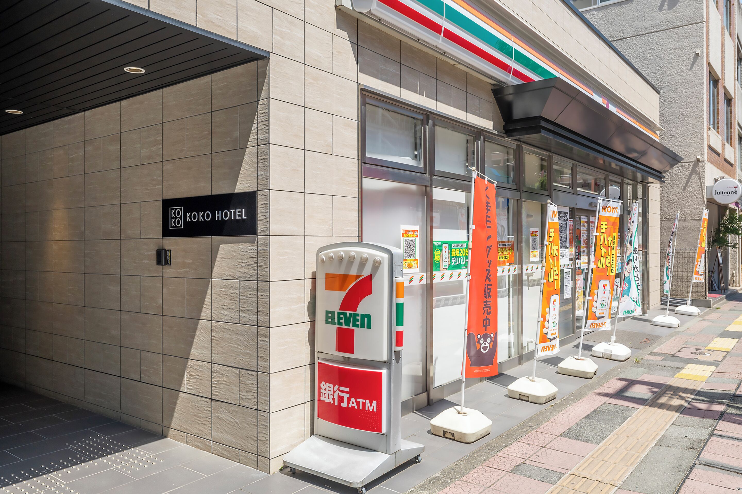 A 7-Eleven convenience store adjacent to a hotel.