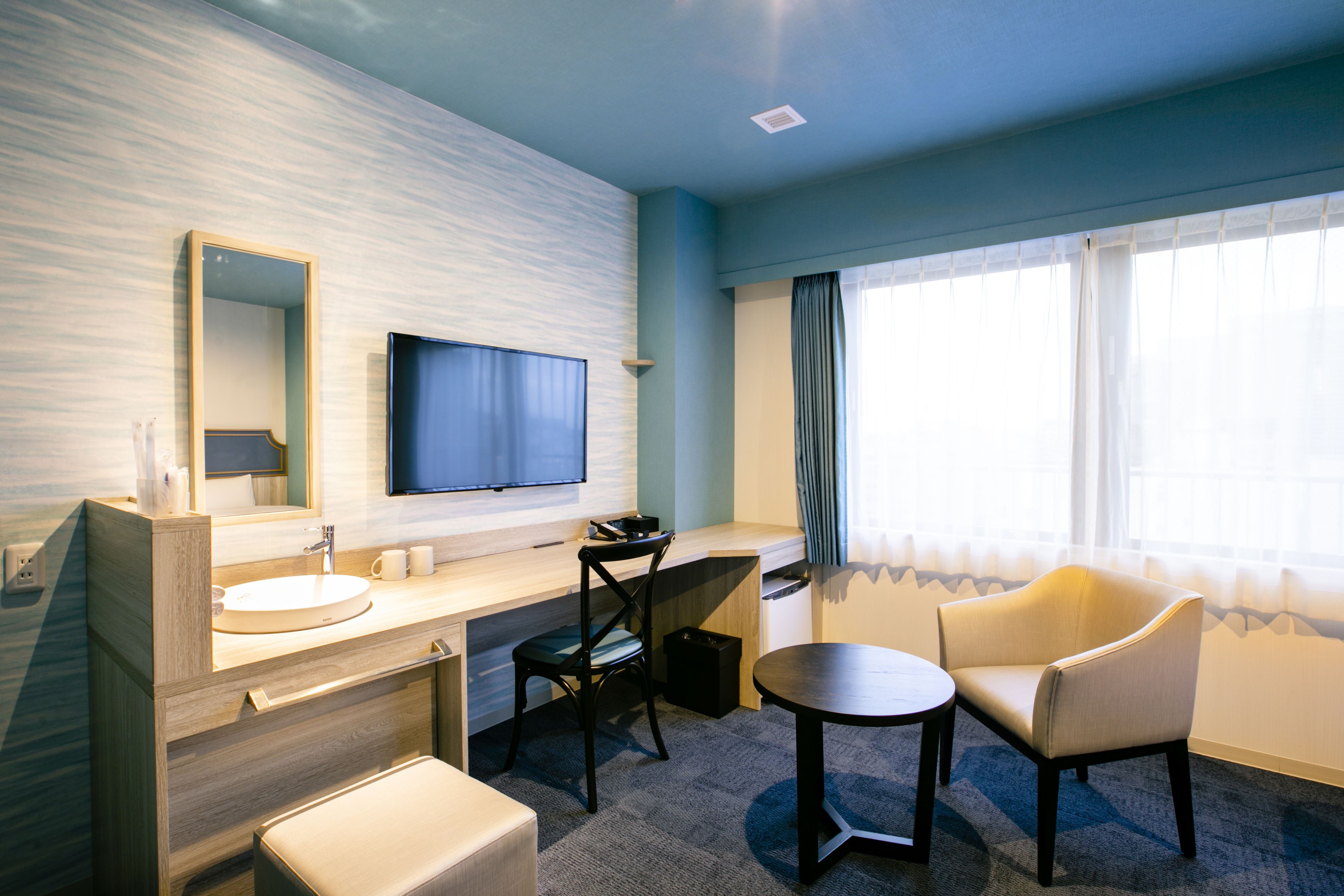 deluxe twin room | desk, laptop workspace, blackout curtains, soundproofing