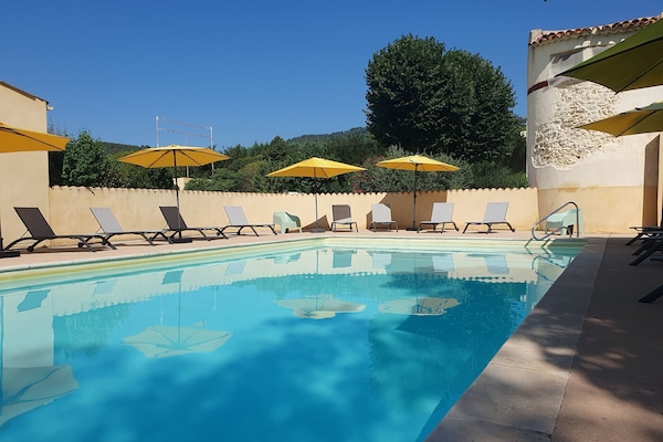 Seasonal outdoor pool, open 9:30 AM to 7:30 PM, pool umbrellas