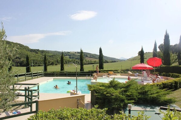 2 outdoor pools, open 8:00 AM to 6:00 PM, pool umbrellas, pool loungers