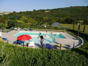 2 outdoor pools, open 8:00 AM to 6:00 PM, pool umbrellas, pool loungers
