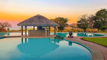 Outdoor pool, open 7:00 AM to 9:00 PM, pool loungers