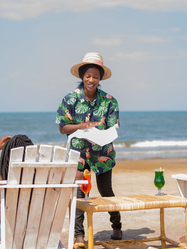 On the beach, sun-loungers, beach towels, beach volleyball