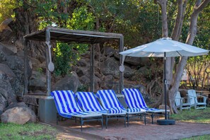 Outdoor pool, open 7:00 AM to 9:00 PM, pool loungers