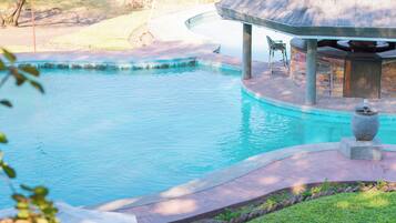 Outdoor pool, open 7:00 AM to 9:00 PM, pool loungers