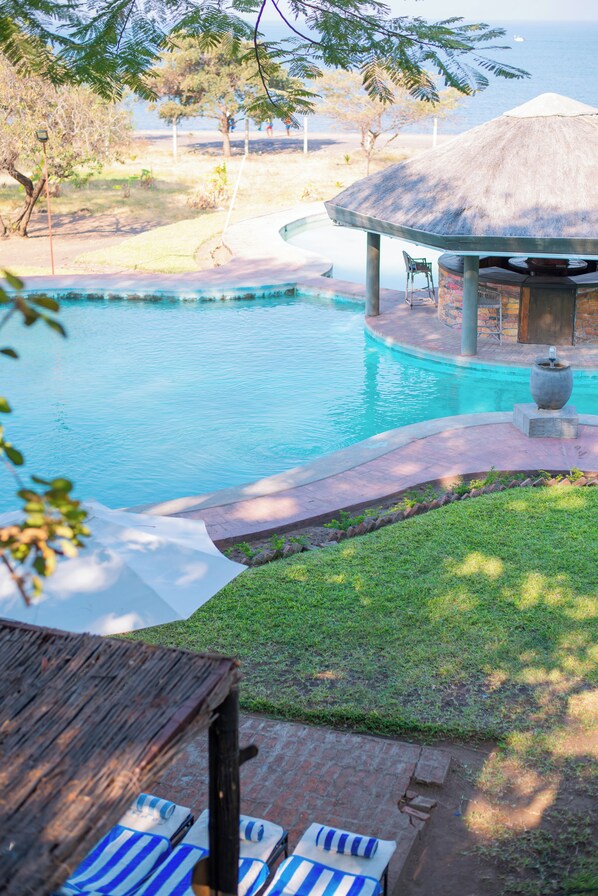 Outdoor pool, open 7:00 AM to 9:00 PM, pool loungers