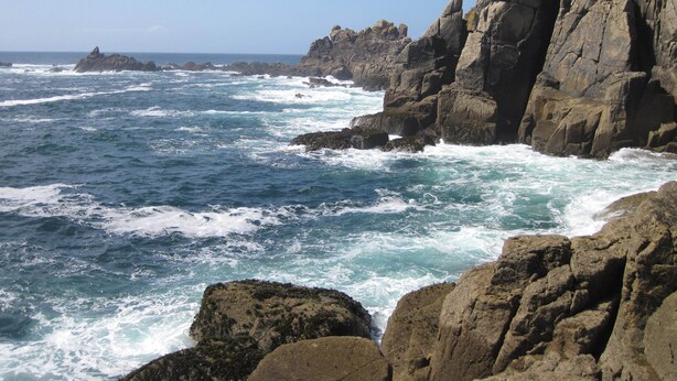 A rocky coastline with waves crashing against the rocks. - Little Pengelly Farm (Hayle)