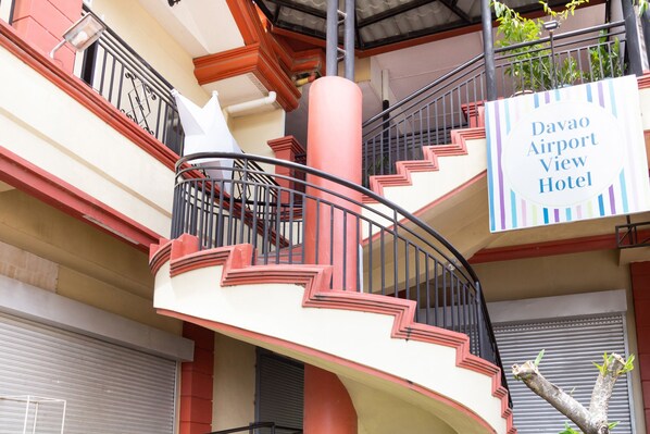 A spiral staircase with a sign for Davao Airport View Hotel. - Davao Airport View Hotel (Davao)
