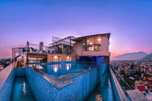 Outdoor pool, open 6:00 AM to 10:00 PM, sun loungers