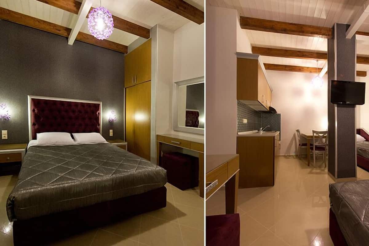 Un dormitorio con una cama grande, un armario y una pequeña zona de escritorio.
