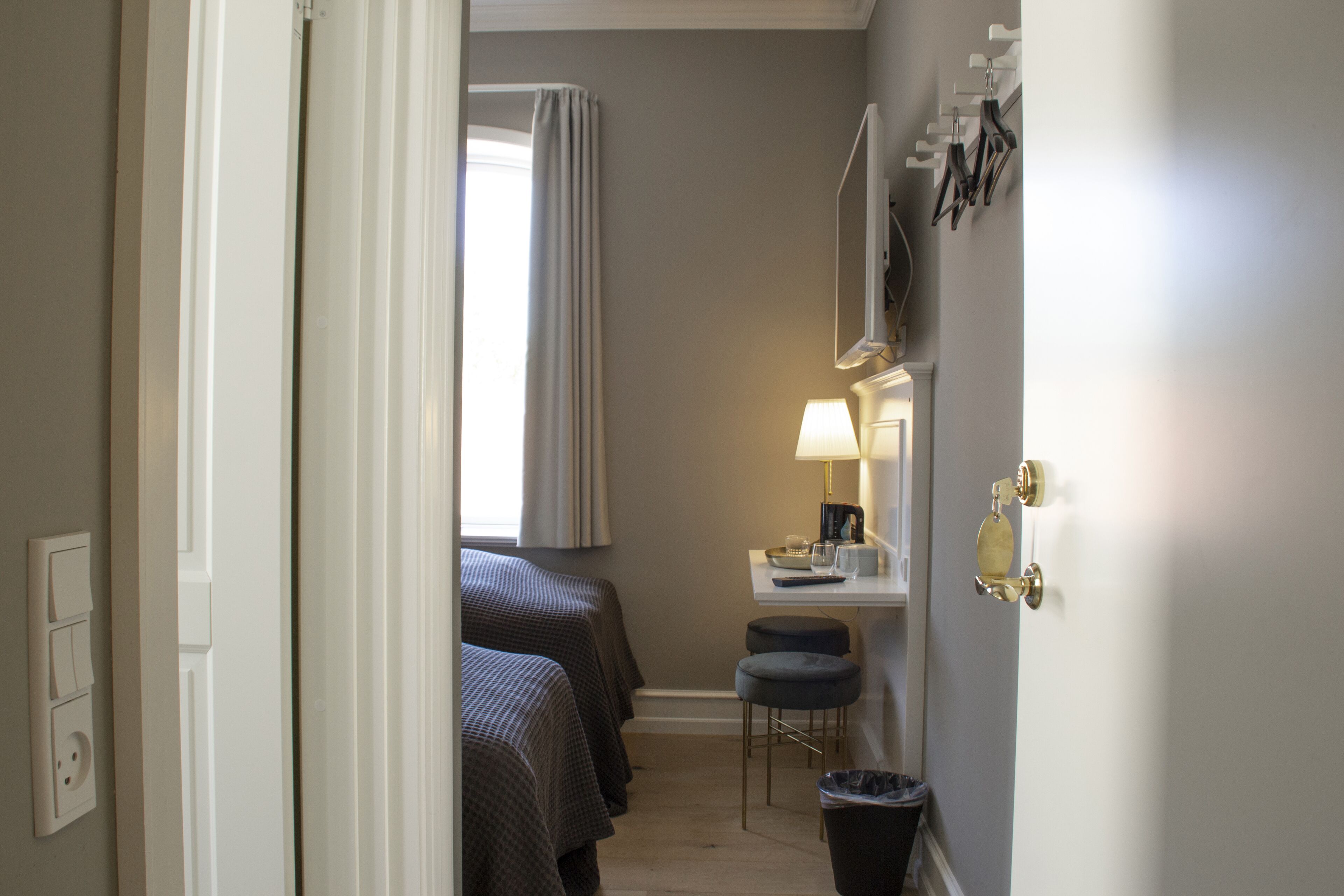 standard double room, 2 single beds | 1 bedroom, desk, blackout curtains, iron/ironing board