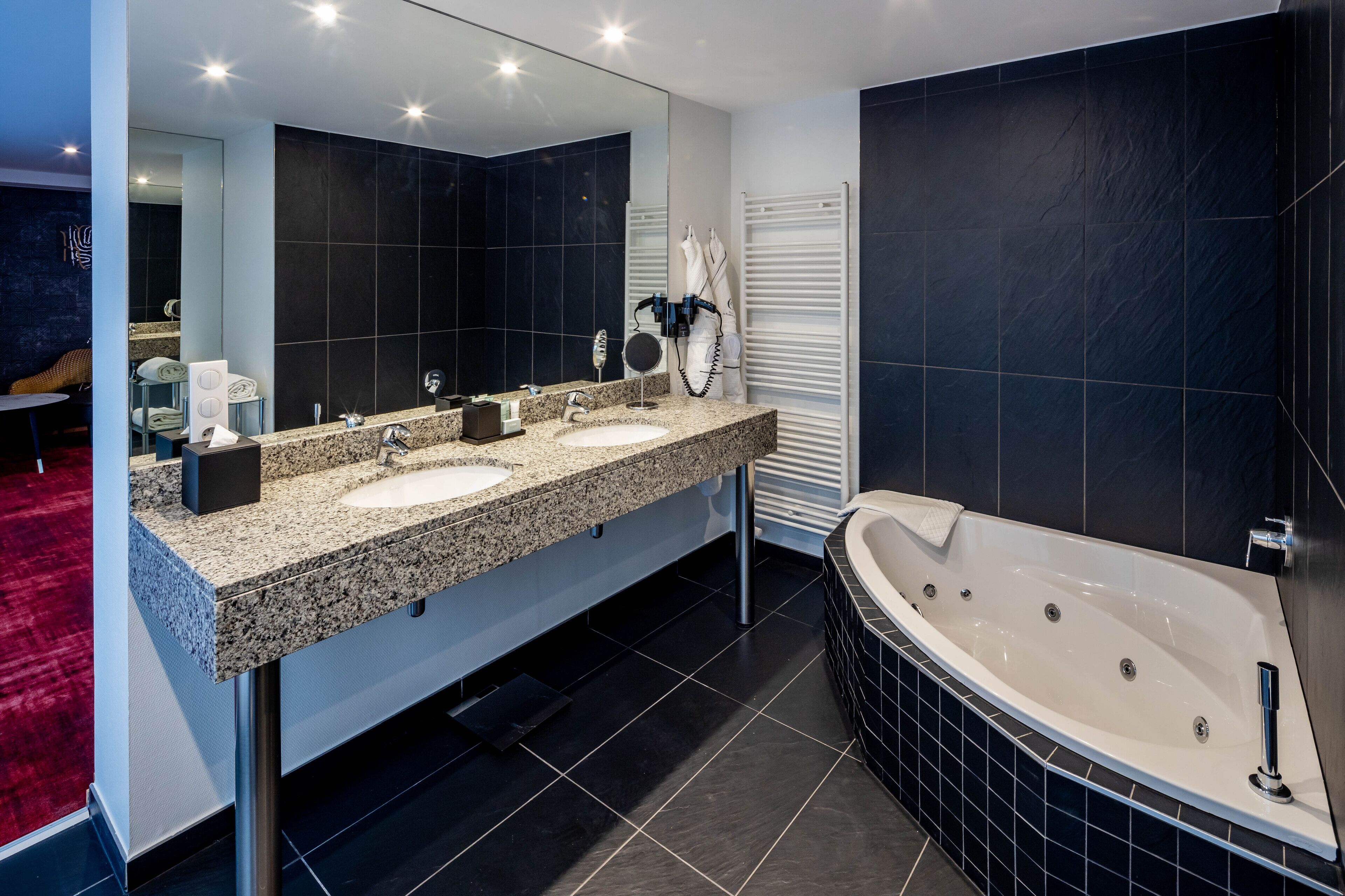 signature suite | bathroom | free toiletries, hair dryer, bathrobes, slippers