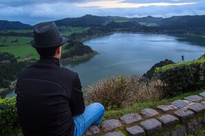 Guests can enjoy serene lake views from a scenic ledge.