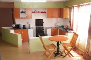 Apartment, 3 Bedrooms | Private kitchen | Fridge, microwave, oven, stovetop