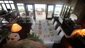 A restaurant with a view of the outdoor patio. - Pumzika Tu (Kwale)