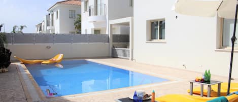 Seasonal outdoor pool, pool umbrellas, pool loungers