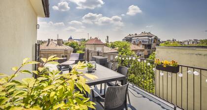 Enjoy the large terrace of your new apartment near the City Park!