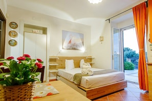 Deluxe Double Room | Living area | Flat-screen TV