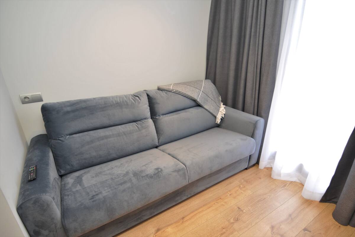 triple room | living area | flat-screen tv