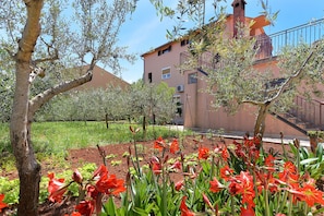 Guests can enjoy a balcony with a garden view.