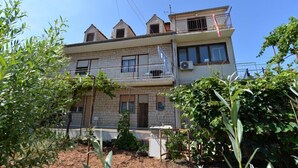 A two-story building with a balcony on the upper floor. - Apartment 695 (Pula)