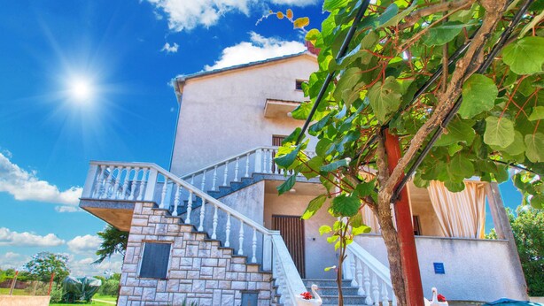 A two-story house with a stone staircase and a balcony. - Apartment 711 (Fazana)