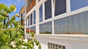 A building with large windows and a white exterior wall. - Apartment 1355 (Pula)